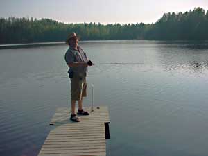fishing vissen summer cottages zomerhuisjes - skandinavia - skiing, snowboarding, dogsleds, snow mobiles, trekking, fishing, swimming and sauna holidays - vacations in your own cottage in south east Finland - summer, fall, autumn, winter and spring at Penttilä Gardens