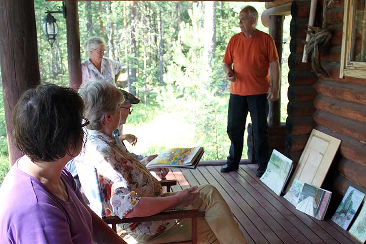 On the dock we start painting the lake scene. The Puukonsaari art workshop.